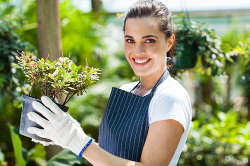 South Woodford gardeners planting vibrant flowers in a garden